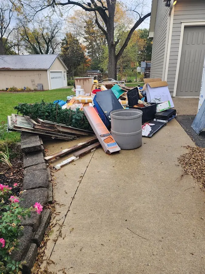 Dumpster being loaded with debris for 3 Yard Dumpster Rental in Centerville